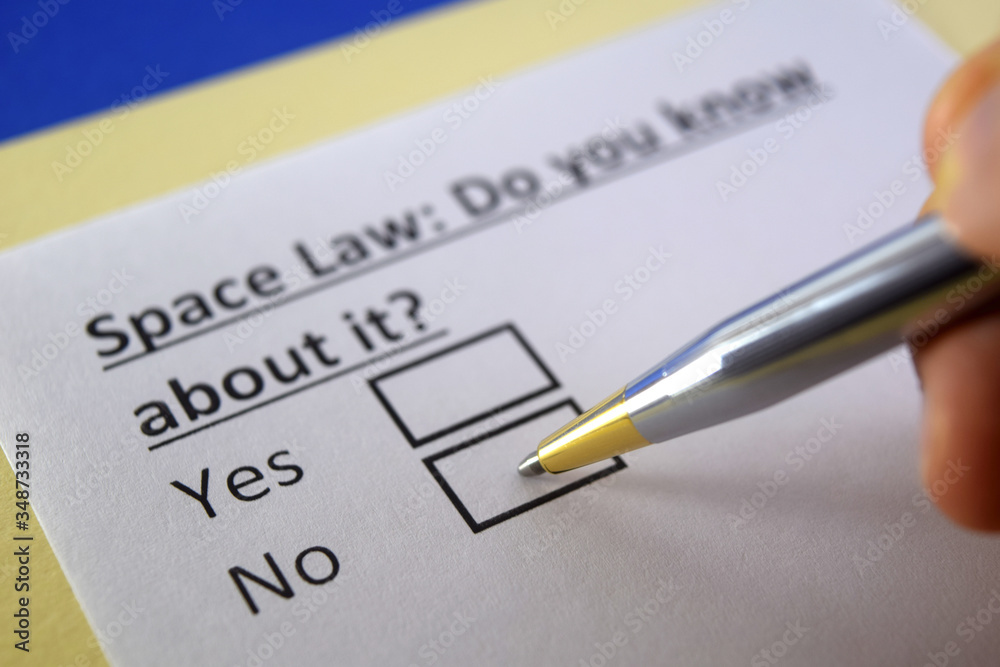 One person is answering question about space law. One person is answering question about space law.