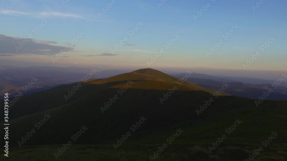 Drone flight over the Ukrainian Carpathians. Mountains on a summer sunny day. Young couple on the beautiful cities of the planet Drone flight over the Ukrainian Carpathians. Mountains on a summer sunny day. Young couple on the beautiful cities of the planet