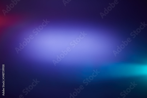 Cloud of light with red and light blue rays of light on a blue background