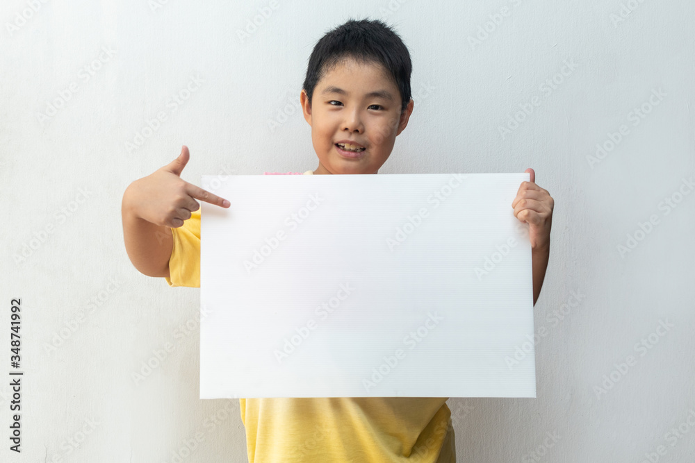 Asian boy holding empty Whiteboard. Concept of education Asian boy holding empty Whiteboard. Concept of education