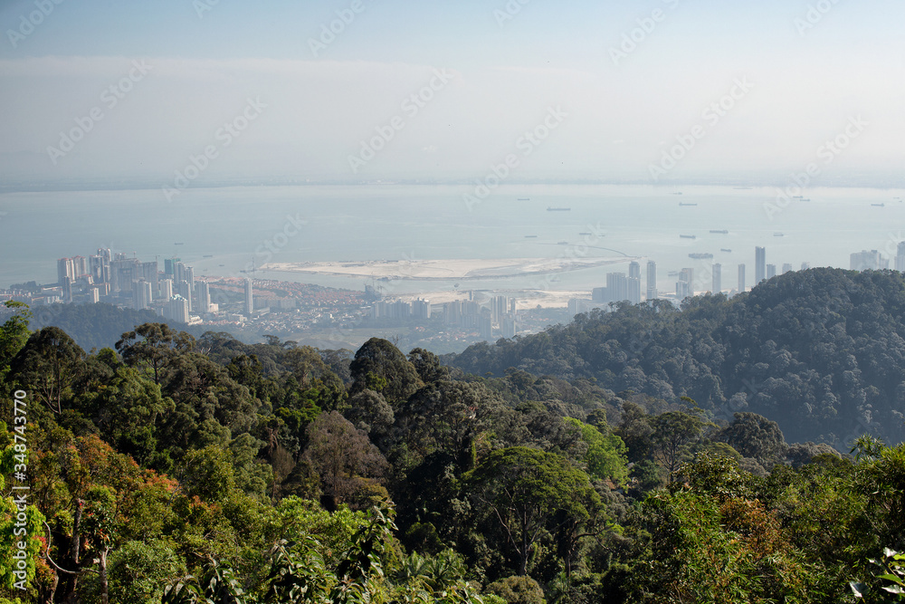 Lookng down through very heavy pollution haze to the city of George Town on Penang Island
