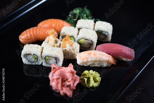 Sushi set with 12 pieces and various maki photo