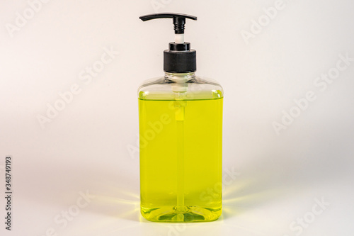 Isolated bottle of green colored hand sanitizer gel liquid 