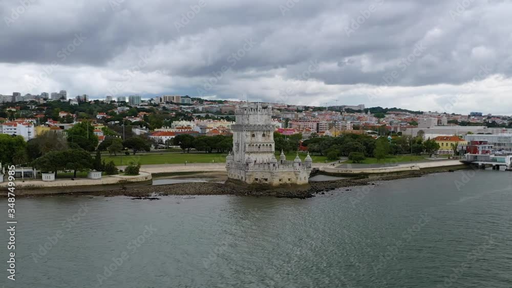 Aerial, orbit, drone shot around empty Torre de Belem tower, cloudy day, in Lisbon, Portugal Aerial, orbit, drone shot around empty Torre de Belem tower, cloudy day, in Lisbon, Portugal