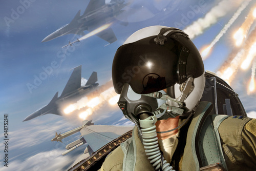 Canvas Print Pilot cockpit view during air to air combat with missiles flares chaff being dep