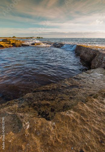 Waves Washing Over Exposed Coral Reef on Salt Pond Beach, Salt Pond Park, Hanapepe, Kauai, Hawaii, USA photo