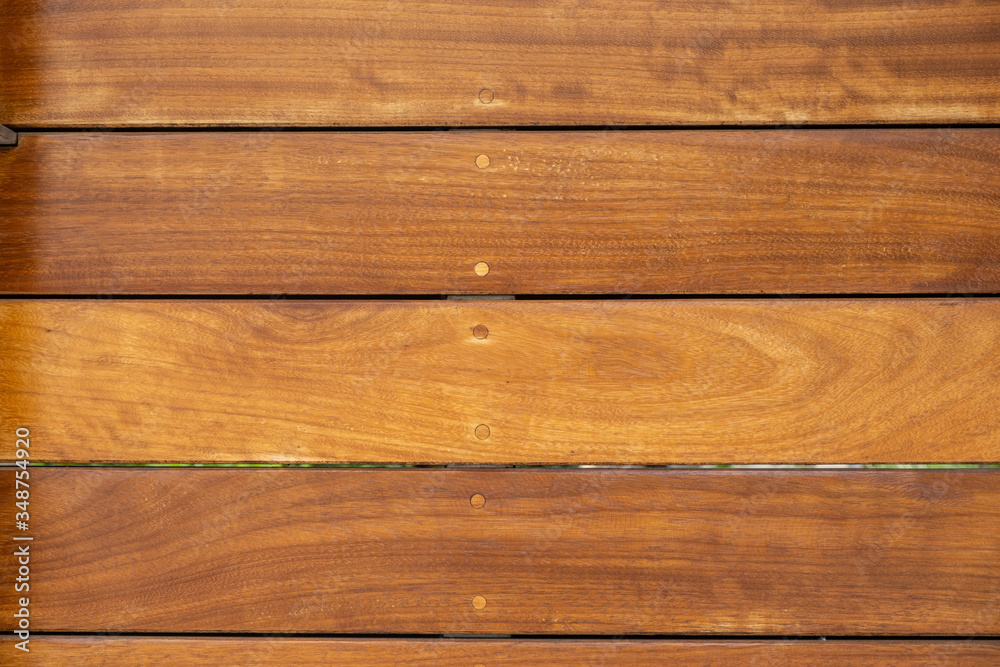 Fototapeta premium Wood floor background. Wooden flooring outdoors, natural color, top view