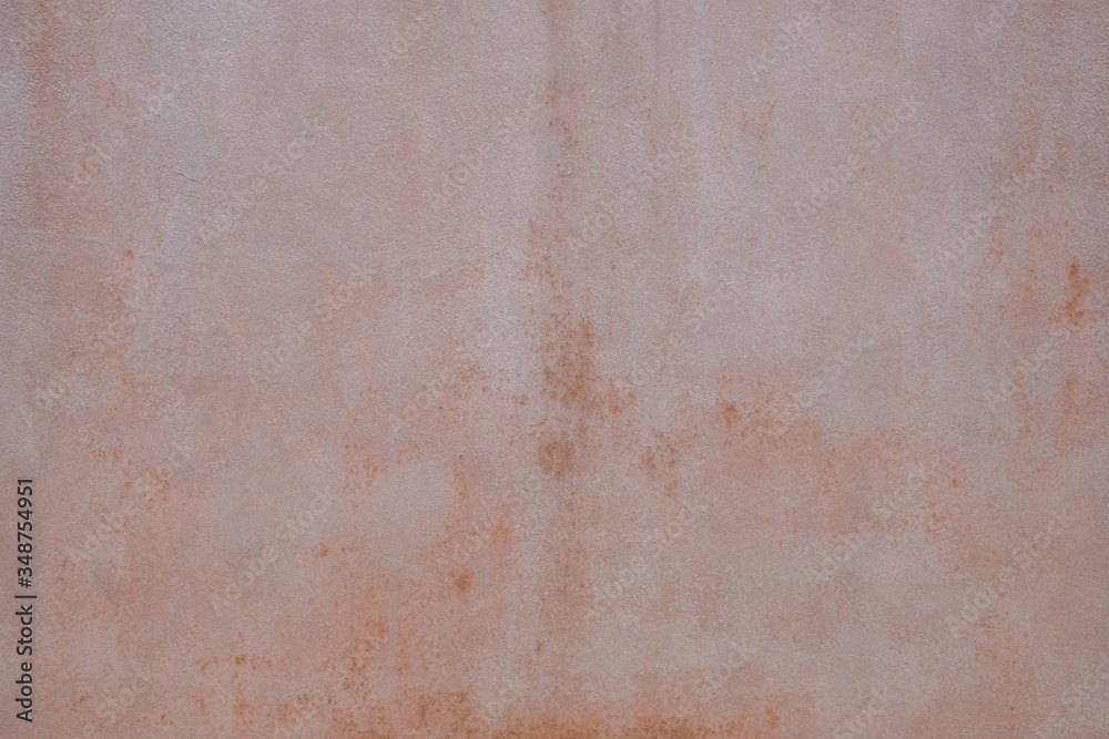 Wall plaster background texture. Pinkish color rough material