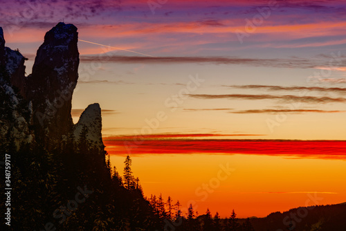 sunset on the rocks of the snowy mountain