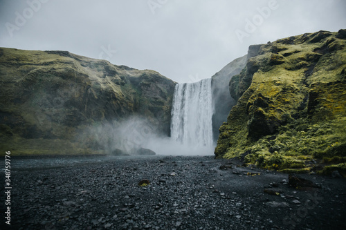waterfall in the mountains, Skogafoss in Iceland 