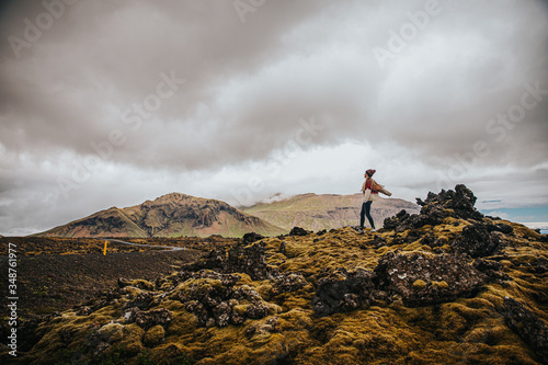 Girl on top of Rocks in the middle of nowhere  Iceland