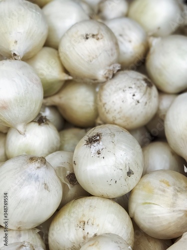 white onions harvest from field in the supermarket