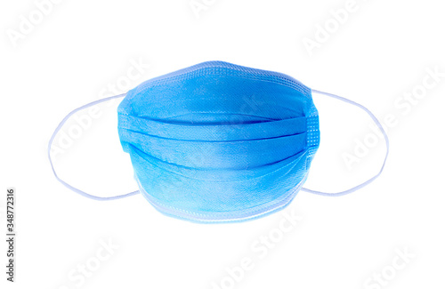 Blue surgical mask isolated over white background photo