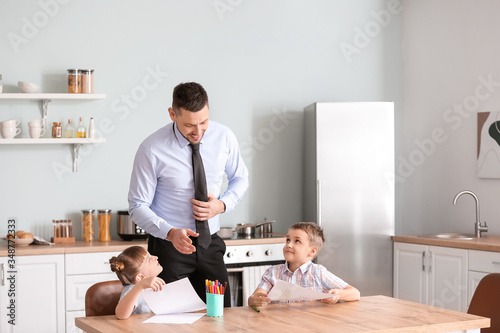 Happy children with father ...