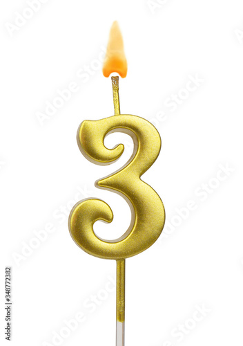 Burning birthday golden candle isolated on white background, number 3