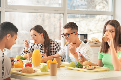 Pupils having lunch at scho...