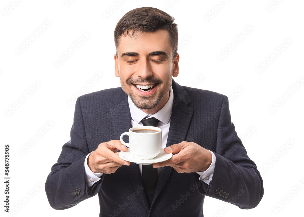 Young businessman with cup of hot coffee on white background Young businessman with cup of hot coffee on white background
