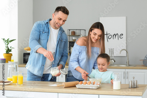 Happy family making dough t...