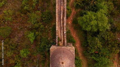 Aerial top down view over waterway stone aqueduct tilt up at the end photo