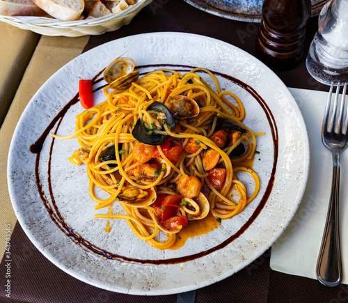 Delicious  spaghetti of  shrimps, mussels and  vegetables