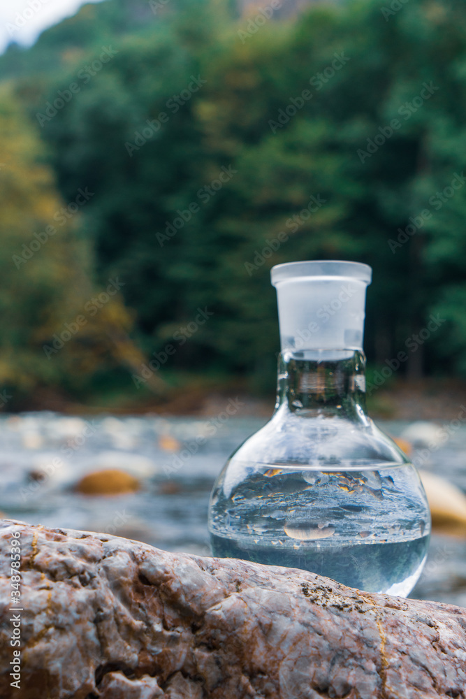 Obraz premium Glass flask with clean drinking water.