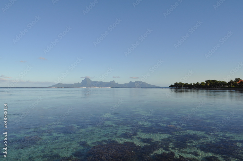 Tahiti waters looking like an infinity pool that stretches out to the island of moorea