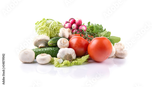 vegetables tomatoes  lettuce  radishes  mushrooms champignon   cucumbers  garlic on a white isolated background