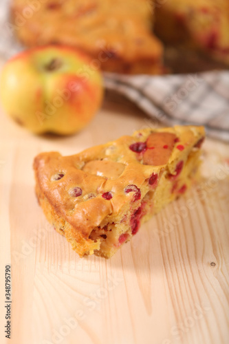 a piece of apple pie with apple and cranberry