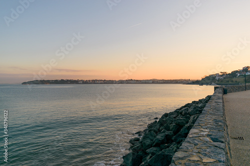 Golden sunrise behind Saint Jean de Luz on the horizon in the background