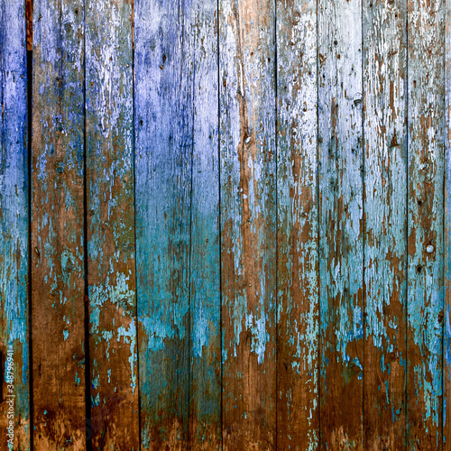 wooden old fence in blue and brown dark colors. Can be used as background