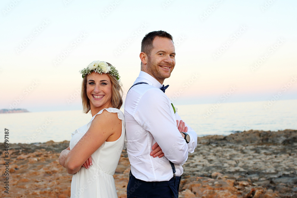 Beach wedding. A young couple at a wedding ceremony. Beach wedding. A young couple at a wedding ceremony.