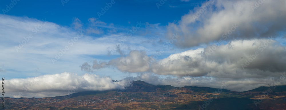 Fototapeta premium Panorama of Rif mountain in Chefchaouen, Morocco. Beautiful scenery with cloudy sky in the mountains
