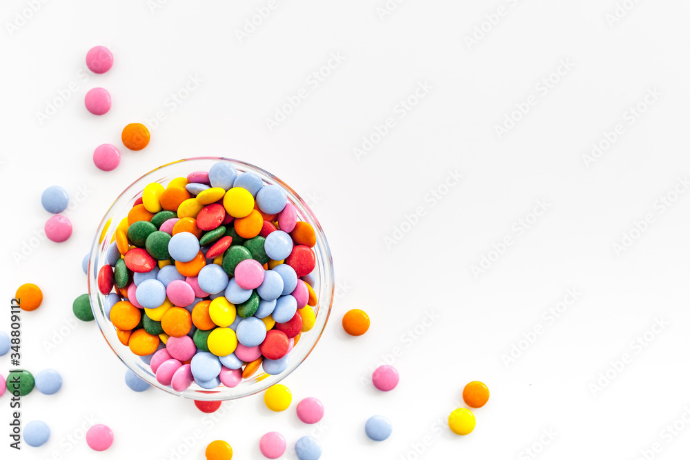 Obraz premium Color candy on white table top-down copy space