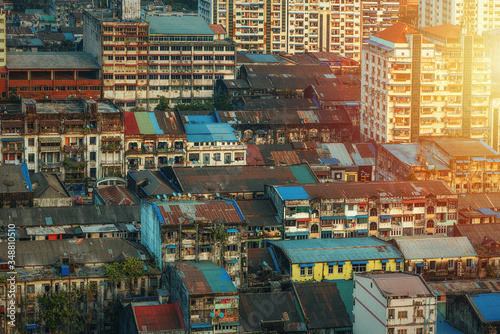 01/22/2020 Yangon, Myanmar (Burma), Aerial shot, view from the drone on the downtovn of Yangon with tiled and moss-covered houses at sunset pop colors. Yangon - the ancient capital of Burma