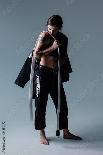 Brazilian jiu jitsu woman athlete in kimono