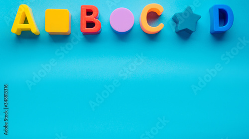 letters abcd on a blue background. layout. children's background