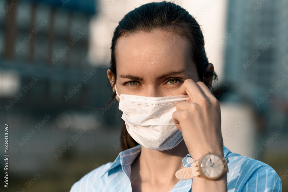 Plakat woman adjusts medical mask on face with hand, allergies, coronavirus