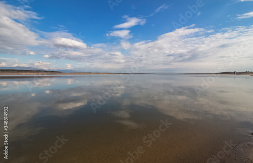 Landscape. The water mirror of the dam, which reflects the cloudy sky. Pyasachnik Dam (sandstone), Belovitsa. Bulgaria © Petia