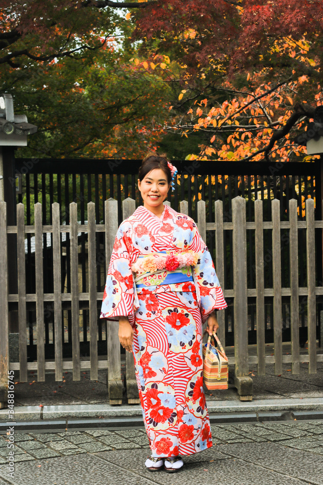Asian beautiful woman  dressing kimono and sightseeing around japanese old house in Kyoto, Japan