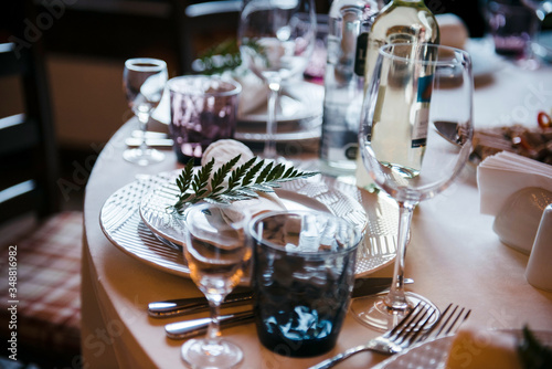 Tables set for an event party or wedding reception. luxury elegant table setting dinner in a restaurant. glasses and dishes.