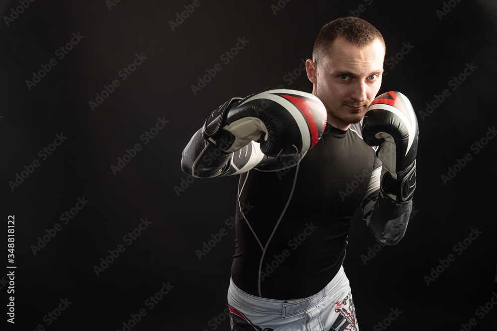 Mixed Martial Arts Fighter Against Dark Background