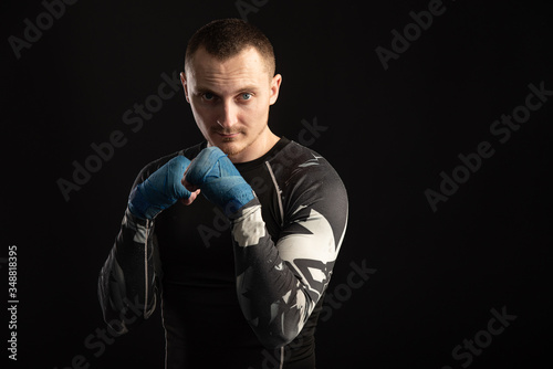 Mixed Martial Arts Fighter Against Dark Background