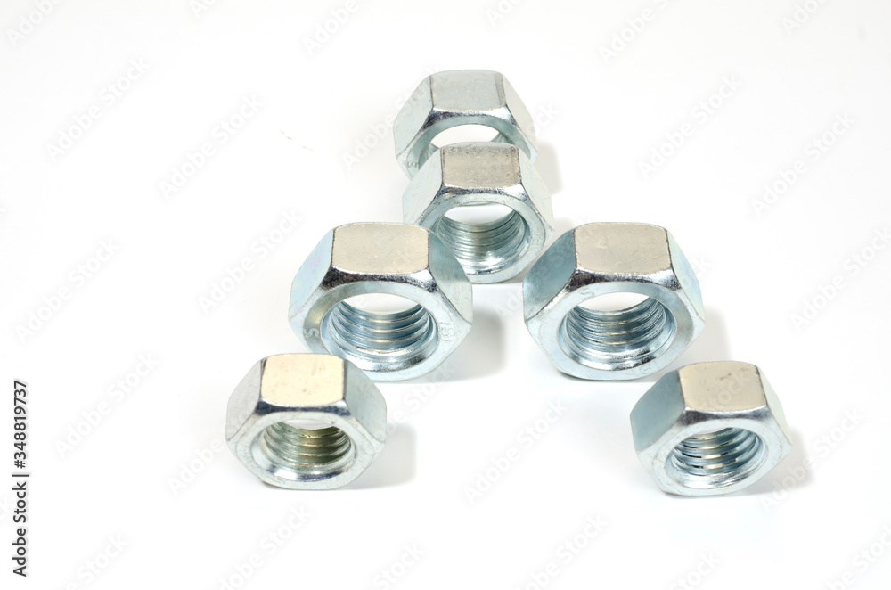 group of new, shiny big nuts on white. group of new, shiny big nuts on white.