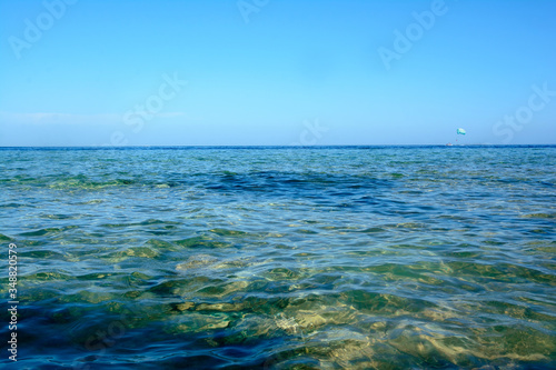 Waves on the beach. Seascape with clear water, horizon.