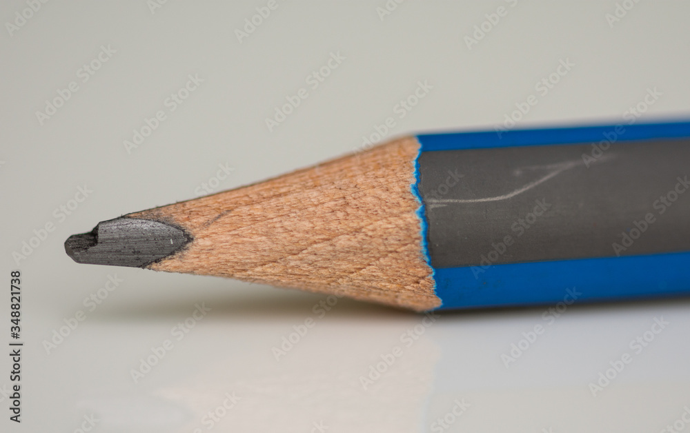 Obraz premium blue gray pencil in high resolution isolated on black background