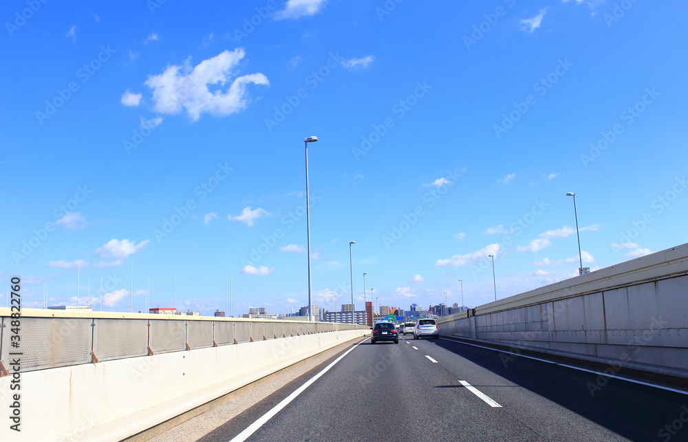 Car driving on metropolitan expressway