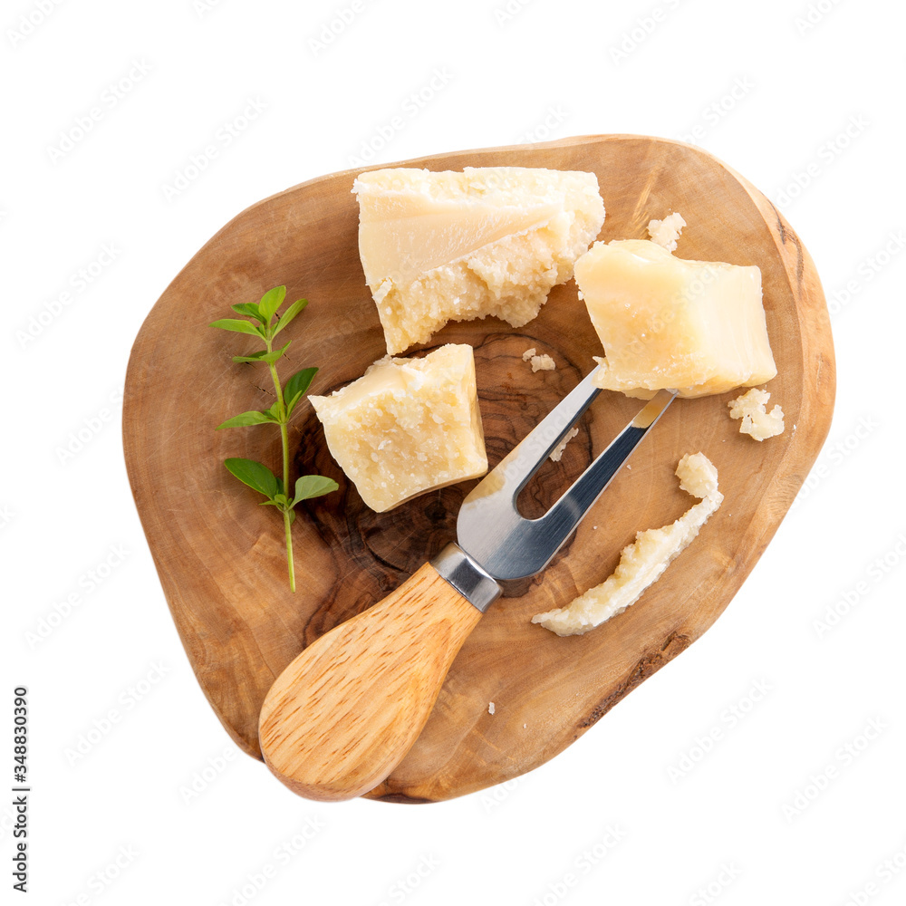 Φωτογραφία Piece of parmesan cheese on wooden board  isolated on white