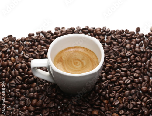 Cup of coffee with beans isolated on white background