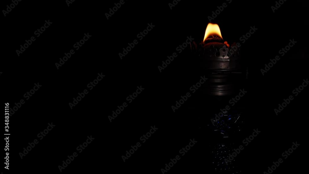 Kerosene lamp fire burns in the dark