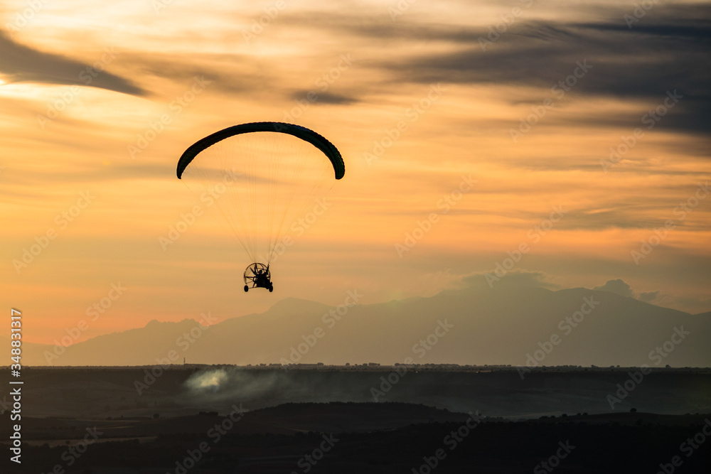 Paragliding with sunset sky with motor Paragliding with sunset sky with motor